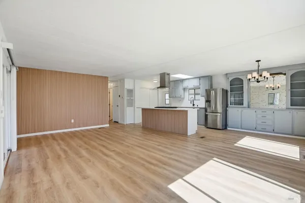 a view of a kitchen with microwave and cabinets