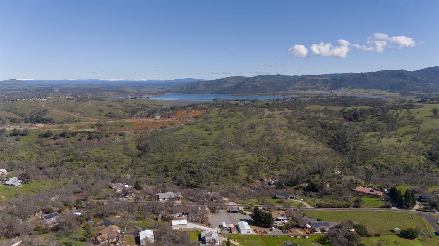 4241 Grisham Road Valley Springs, CA 95252 - Photo 18 of 22 a view of a town with mountains in the background