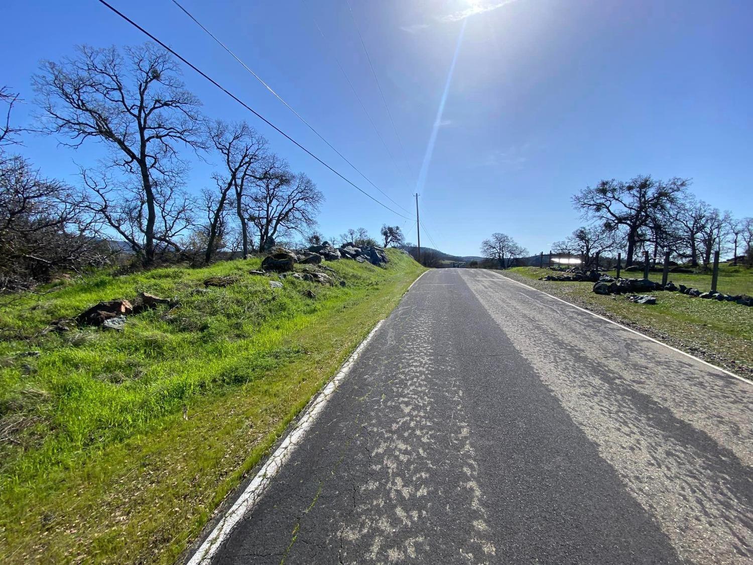 4241 Grisham Road Valley Springs, CA 95252 - Photo 2 of 22 a view of a street with a building in the background