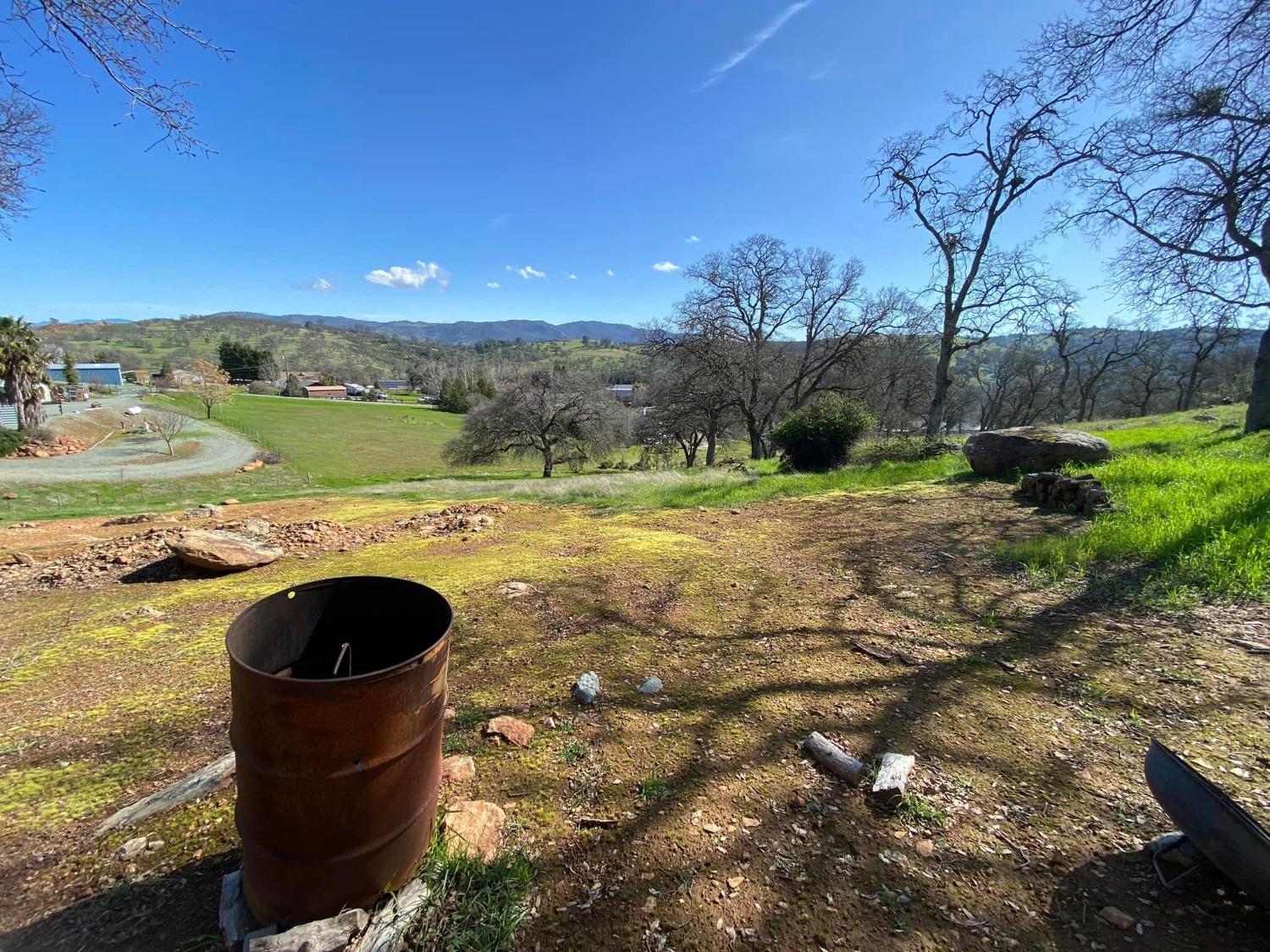 4241 Grisham Road Valley Springs, CA 95252 - Photo 21 of 22 a view of a lake with a yard
