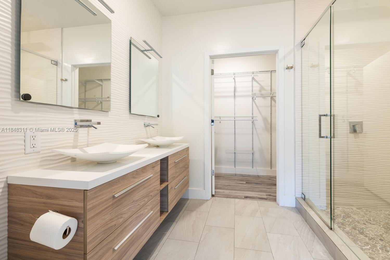 891 Northwest 45th Terrace Plantation, FL 33317 - Photo 14 of 33 a bathroom with a sink vanity and shower