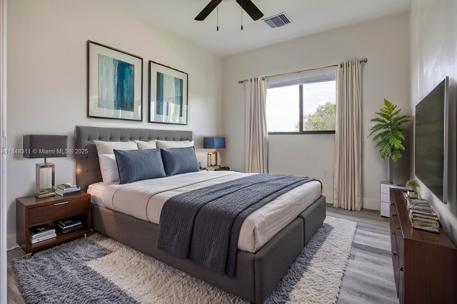 891 Northwest 45th Terrace Plantation, FL 33317 - Photo 15 of 33 a bedroom with a bed a bookshelf and a potted plant