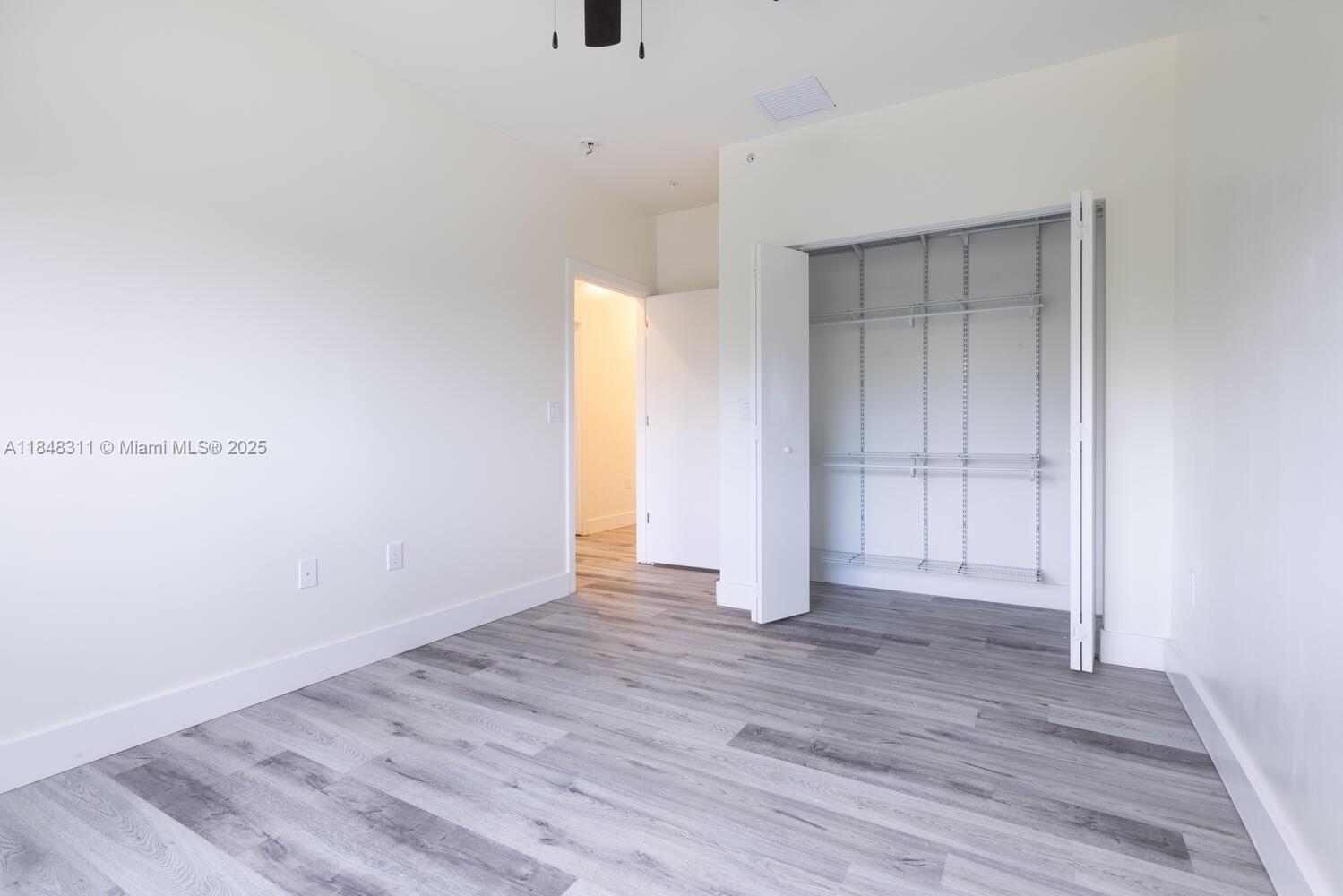 891 Northwest 45th Terrace Plantation, FL 33317 - Photo 17 of 33 a view of an empty room with wooden floor