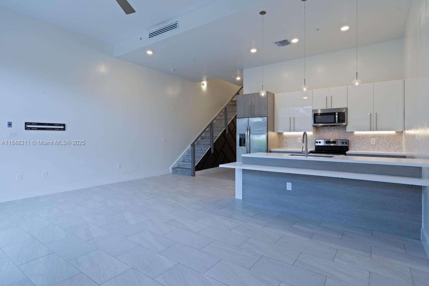 891 Northwest 45th Terrace Plantation, FL 33317 - Photo 5 of 33 a living room with furniture and a fireplace