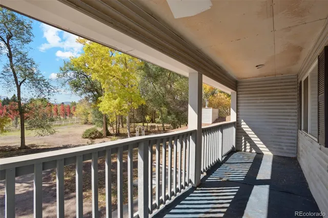a view of a balcony with wooden floor