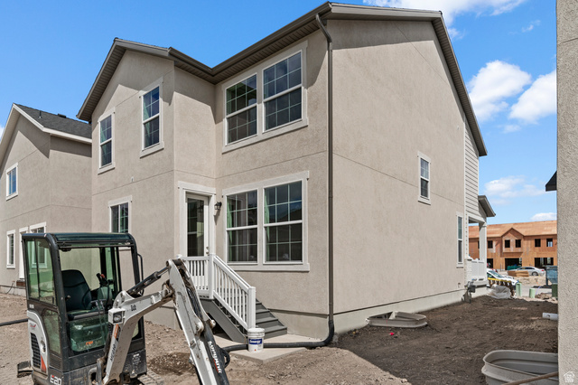 7797 West Alta Springs Way Magna, UT 84044 - Photo 5 of 21 Back of house featuring stucco siding
