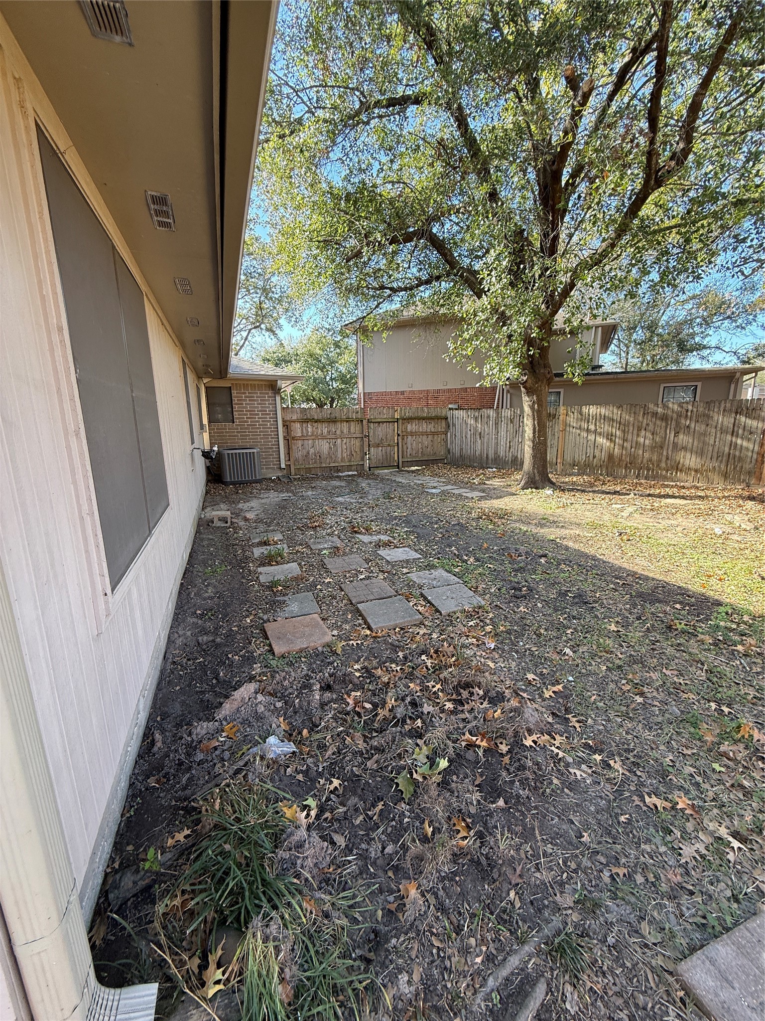5026 Tealgate Drive Spring, TX 77373 - Photo 20 of 22 a view of a yard with wooden fence and a large tree