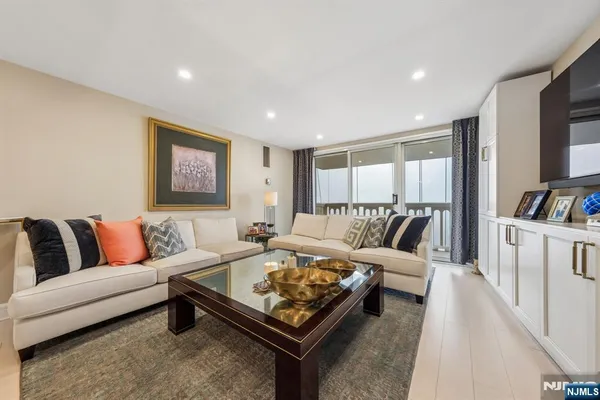 a living room with furniture and a rug