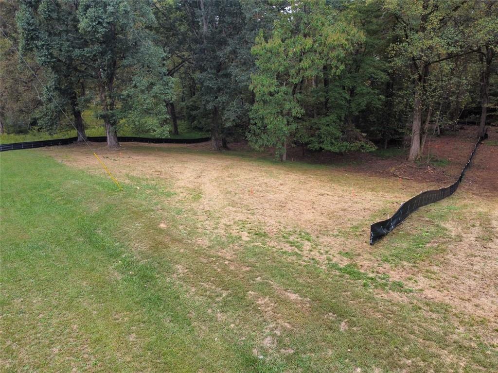 3439 Clarks Bridge Road Gainesville, GA 30506 - Photo 6 of 6 a view of a yard with a bench