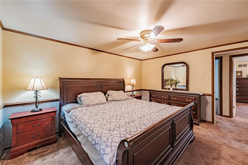 161 Seventh Street Extension Trafford, PA 15085 - Photo 13 of 23 a bedroom with a bed and a chandelier