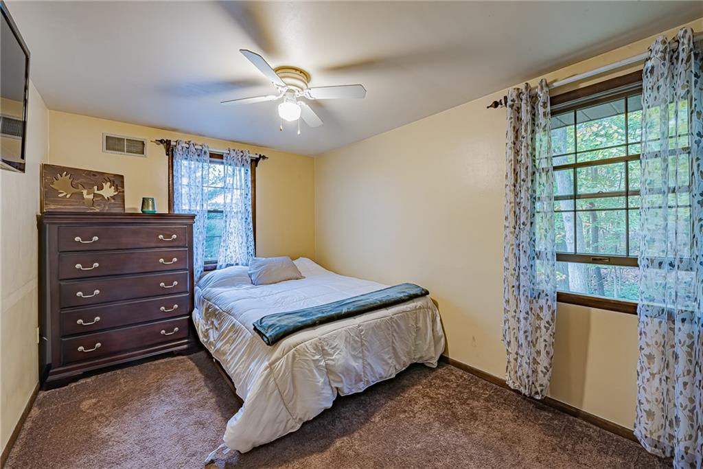 161 Seventh Street Extension Trafford, PA 15085 - Photo 16 of 23 a bedroom with a bed and a mirror