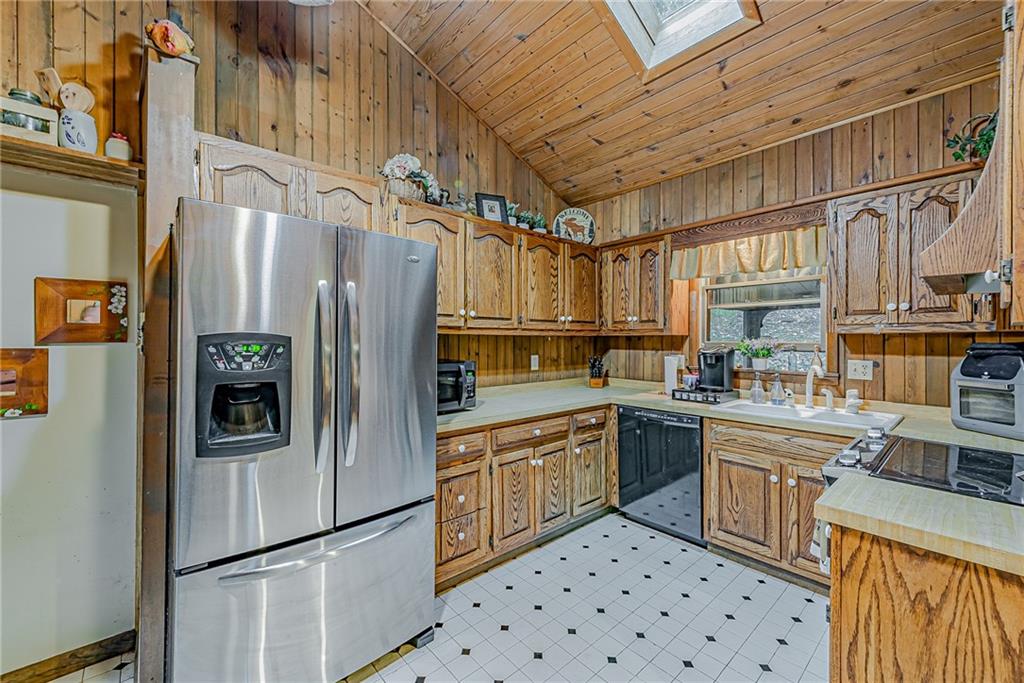 161 Seventh Street Extension Trafford, PA 15085 - Photo 8 of 23 a kitchen with stainless steel appliances a refrigerator sink and stove