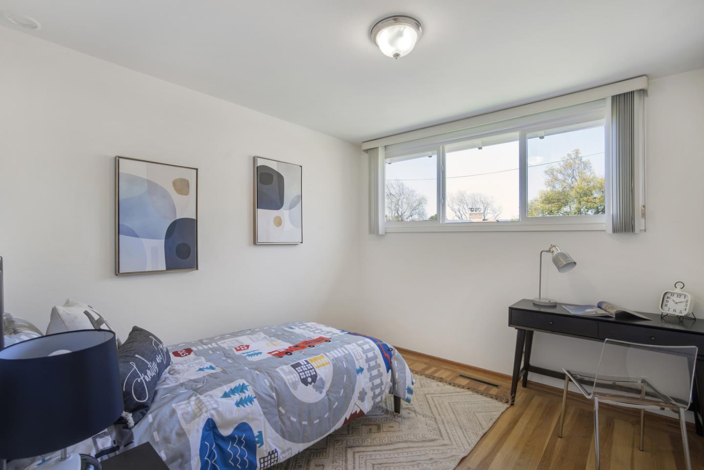 2417 Scanlan Place Santa Clara, CA 95050 - Photo 12 of 22 a bedroom with a bed and a window