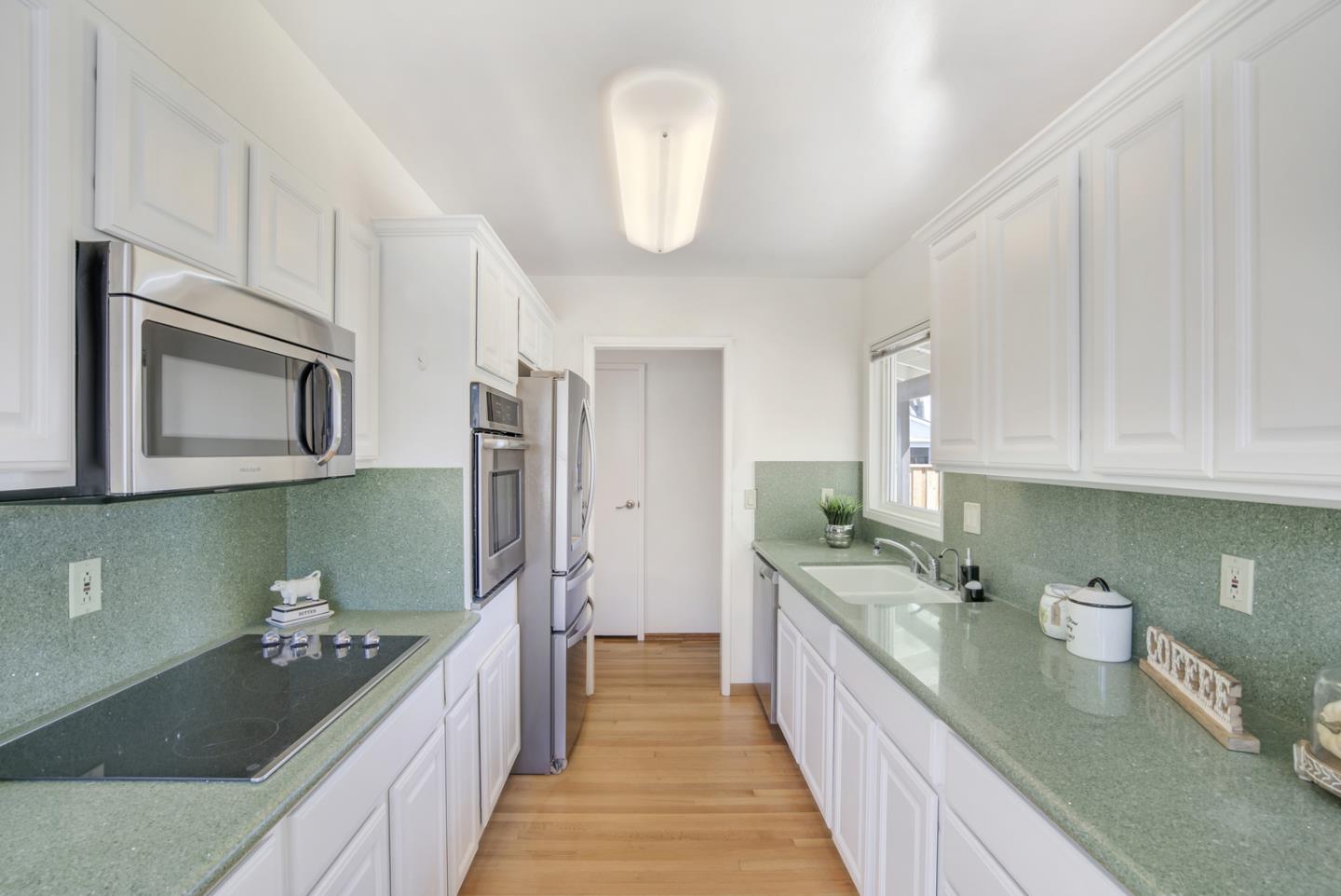 2417 Scanlan Place Santa Clara, CA 95050 - Photo 9 of 22 a kitchen with a sink and a stove top oven