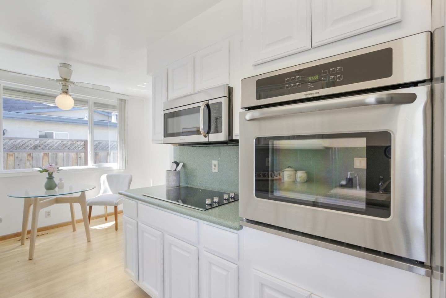 2417 Scanlan Place Santa Clara, CA 95050 - Photo 10 of 22 a living room with furniture and a fireplace