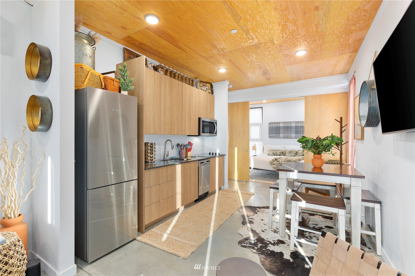 23732 Northwest Cliffe Pointe Road, Unit 1D Quincy, WA 98848 - Photo 6 of 18 a kitchen with stainless steel appliances granite countertop a refrigerator and a stove top oven