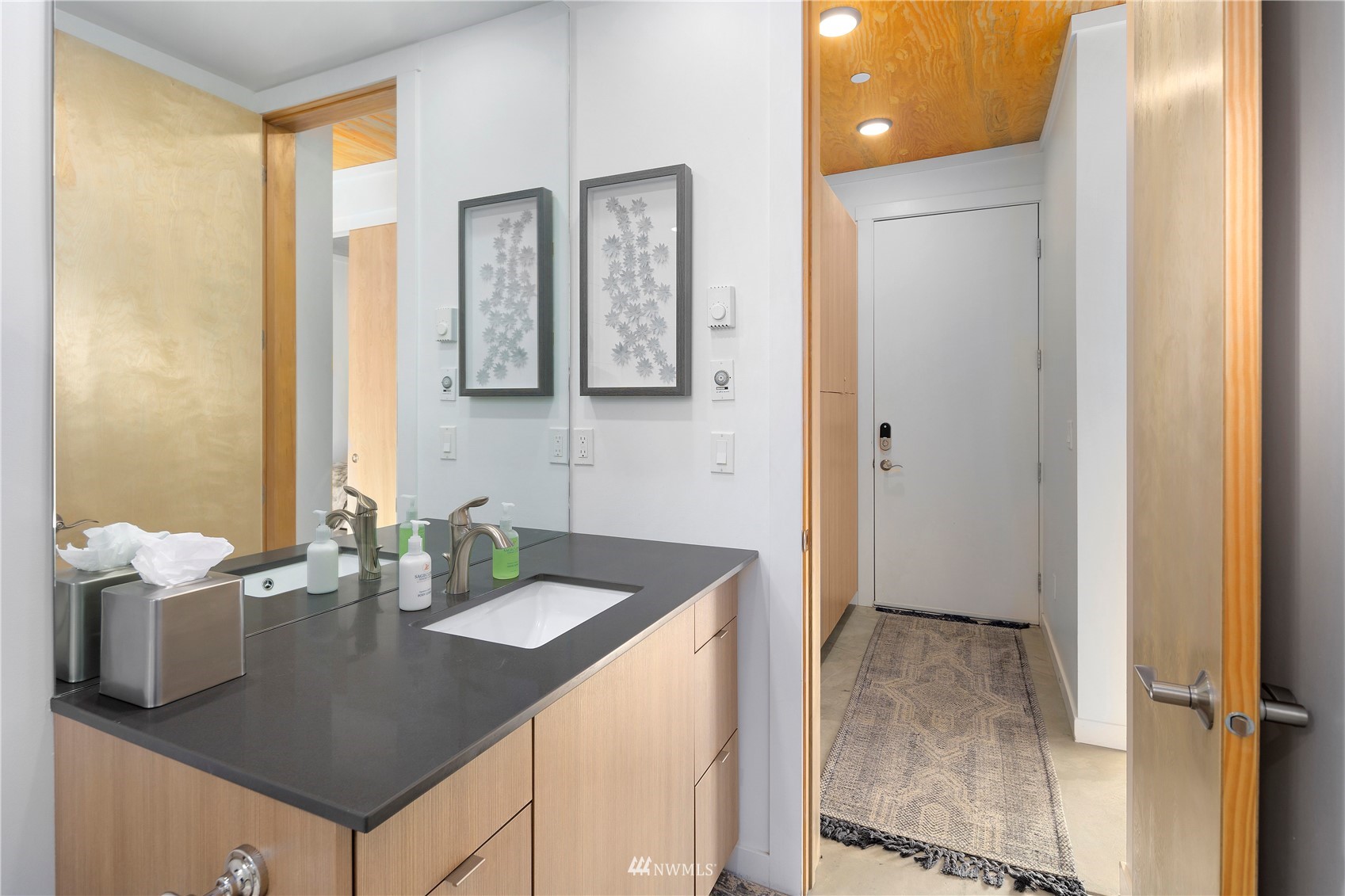 23732 Northwest Cliffe Pointe Road, Unit 1D Quincy, WA 98848 - Photo 10 of 18 a bathroom with a sink vanity and a mirror