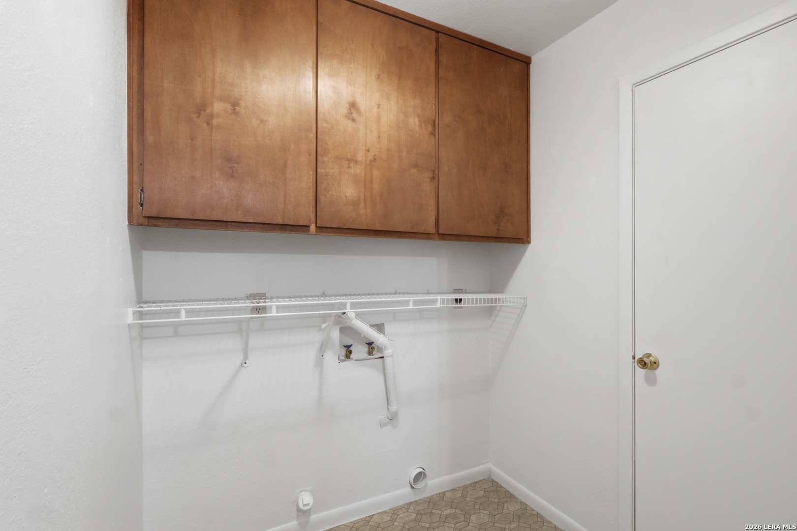 261 Fawn Lane Spring Branch, TX 78070 - Photo 19 of 44 a view of storage and utility room with empty racks