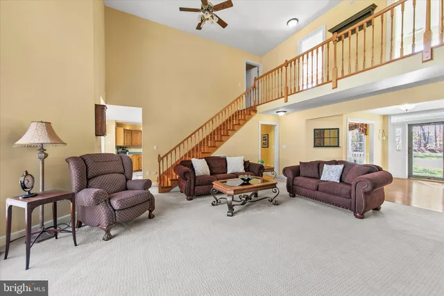 a view of a dining room with furniture and window