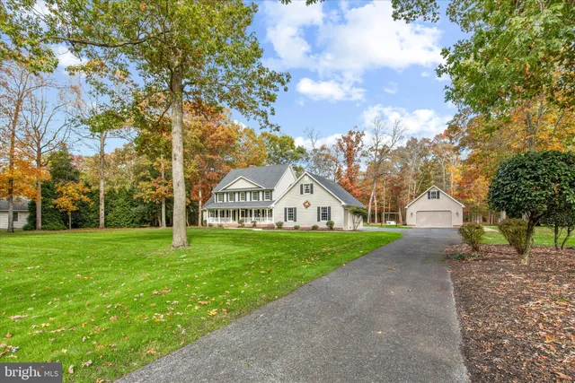 a view of a front of the house and garden