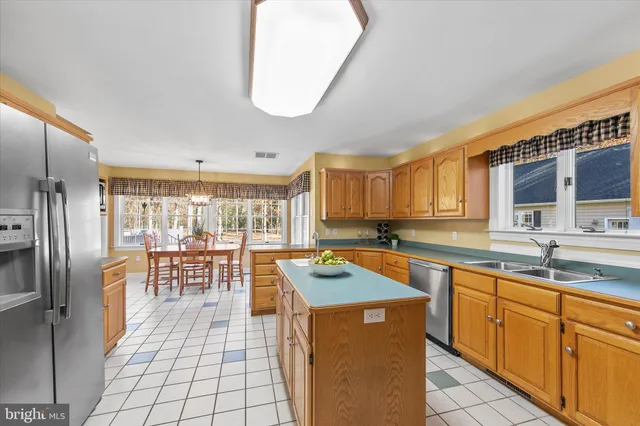 a spacious bedroom with a bed mirror and a large window