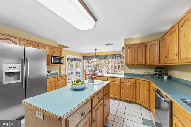 a bedroom with furniture and a chandelier