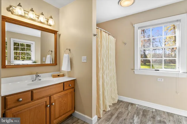 a bedroom with two beds and a window