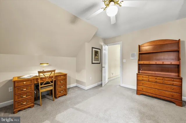 a view of a deck with a table and chairs next to a yard