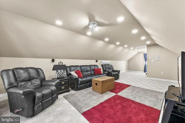 a front view of a house with garden and trees