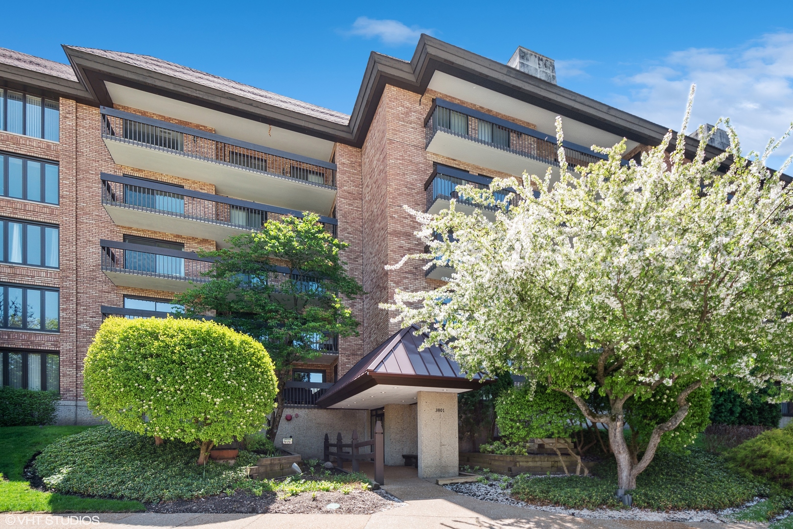 3801 Mission Hills Road, Unit E302 Northbrook, IL 60062 - Photo 1 of 1 front view of house with a yard