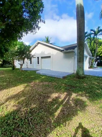a front view of house with garden