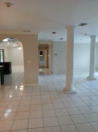a view of a livingroom with an empty space and a sink
