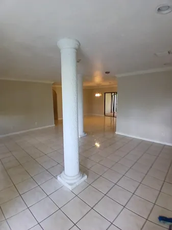 a view of an empty room with a window