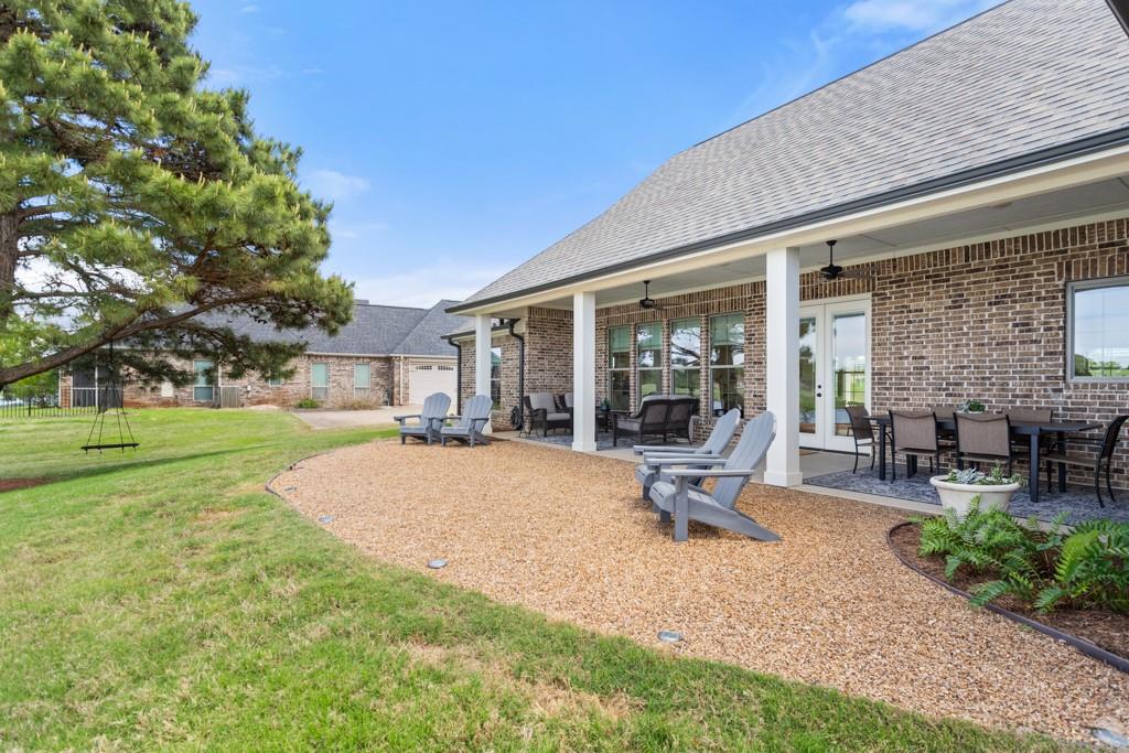 23630 Champion Drive Lindale, TX 75771 - Photo 29 of 36 a view of a house with backyard porch and sitting area
