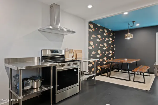 a kitchen with furniture and a fireplace
