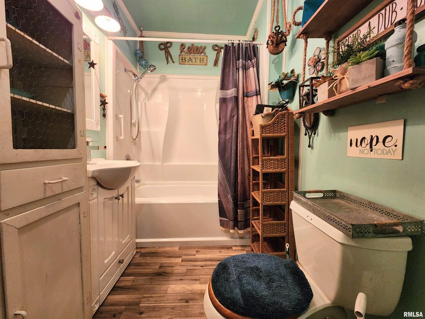 413 North 8th Street Herrin, IL 62948 - Photo 4 of 8 a bathroom with a sink a toilet and shower