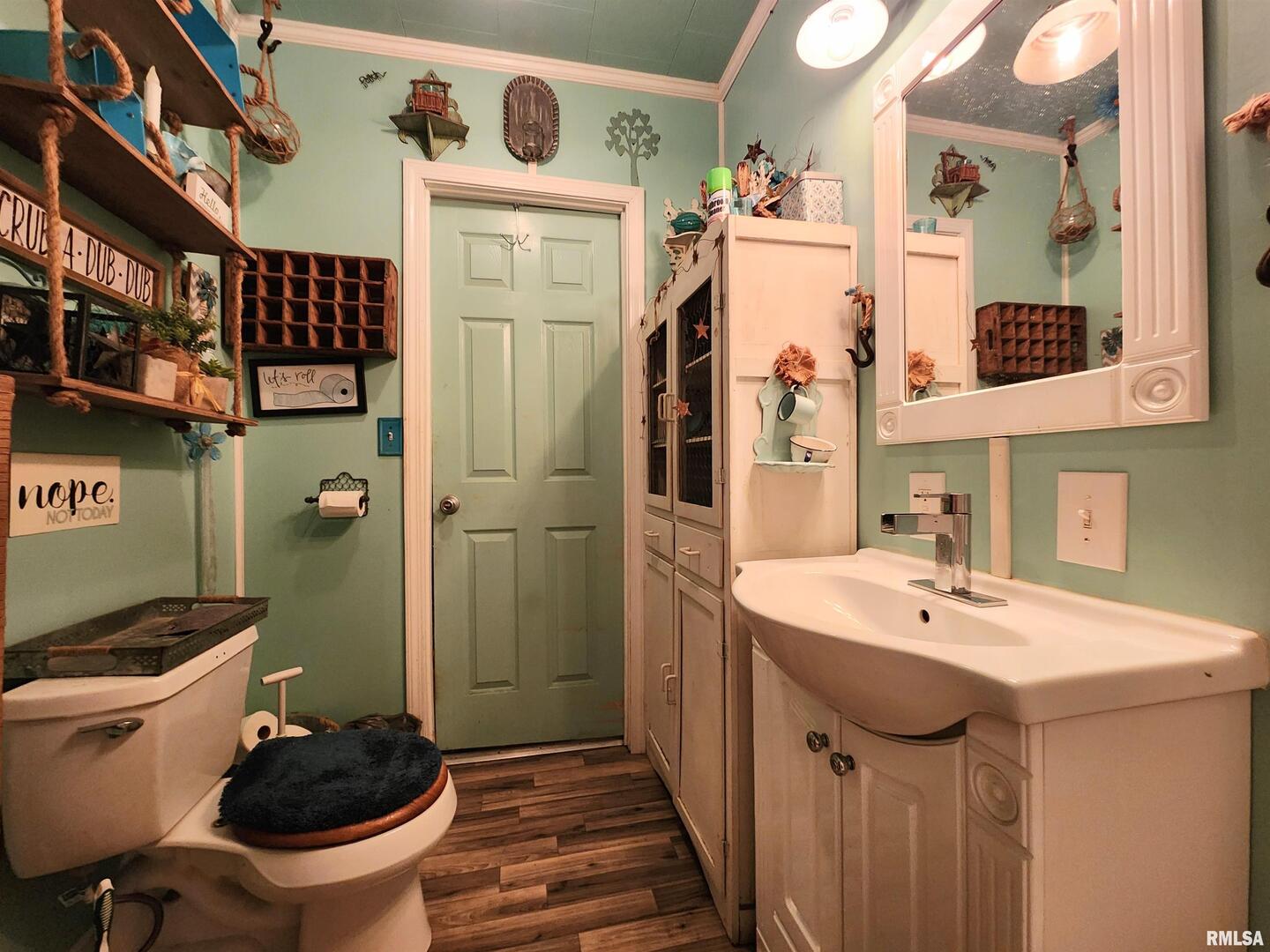 413 North 8th Street Herrin, IL 62948 - Photo 5 of 8 a bathroom with a sink a toilet and shower