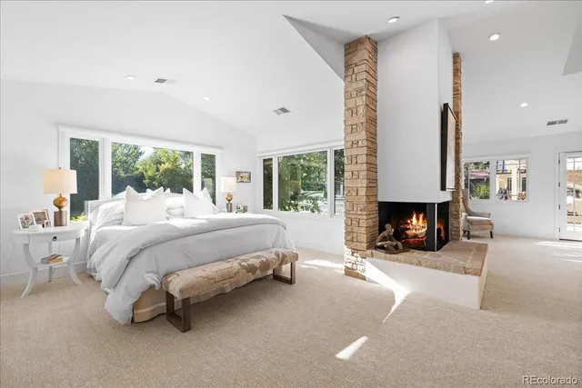 a bed room with a bed and a fireplace