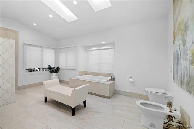 a living room with furniture and a toilet