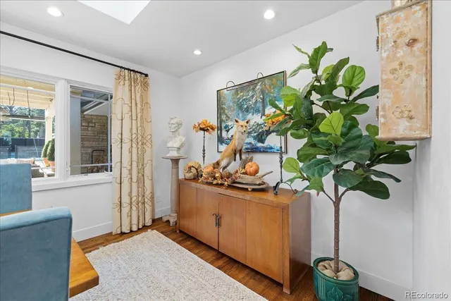 a view of living room with furniture and a potted plant