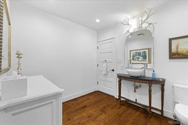 a view of a workspace with wooden floor