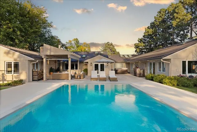 a front view of a house with a yard table and chairs