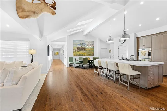 a large room with lots of furniture and a chandelier