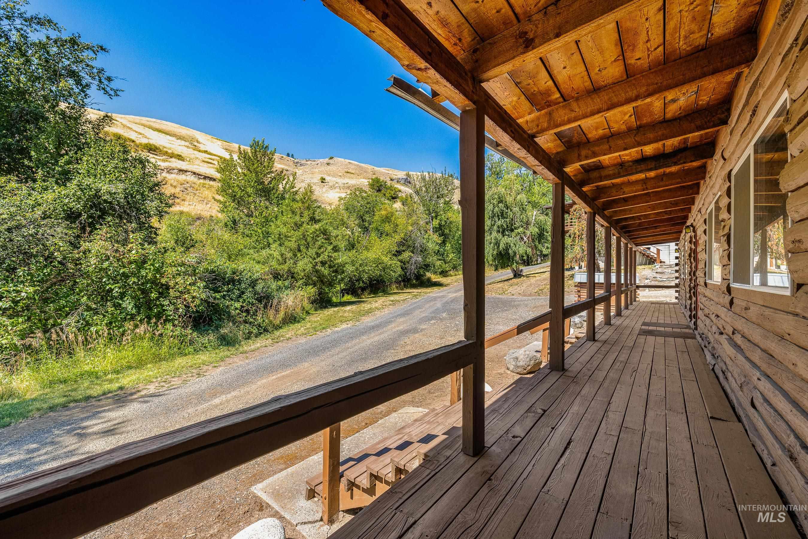 192 East Shingle Creek Road Riggins, ID 83549 - Photo 41 of 50 Wooden porch with a mountain view