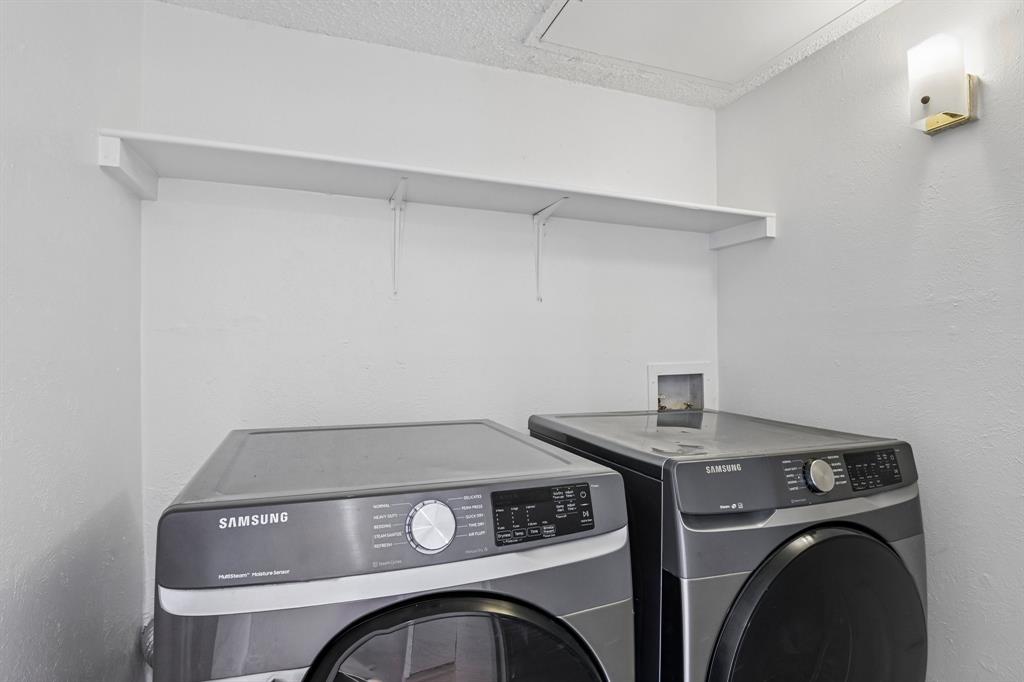 5300 Keller Springs Road, Unit 2055 Dallas, TX 75248 - Photo 19 of 24 Dedicated laundry area featuring a wall-mounted shelf, interior lighting fixture, and white painted walls
