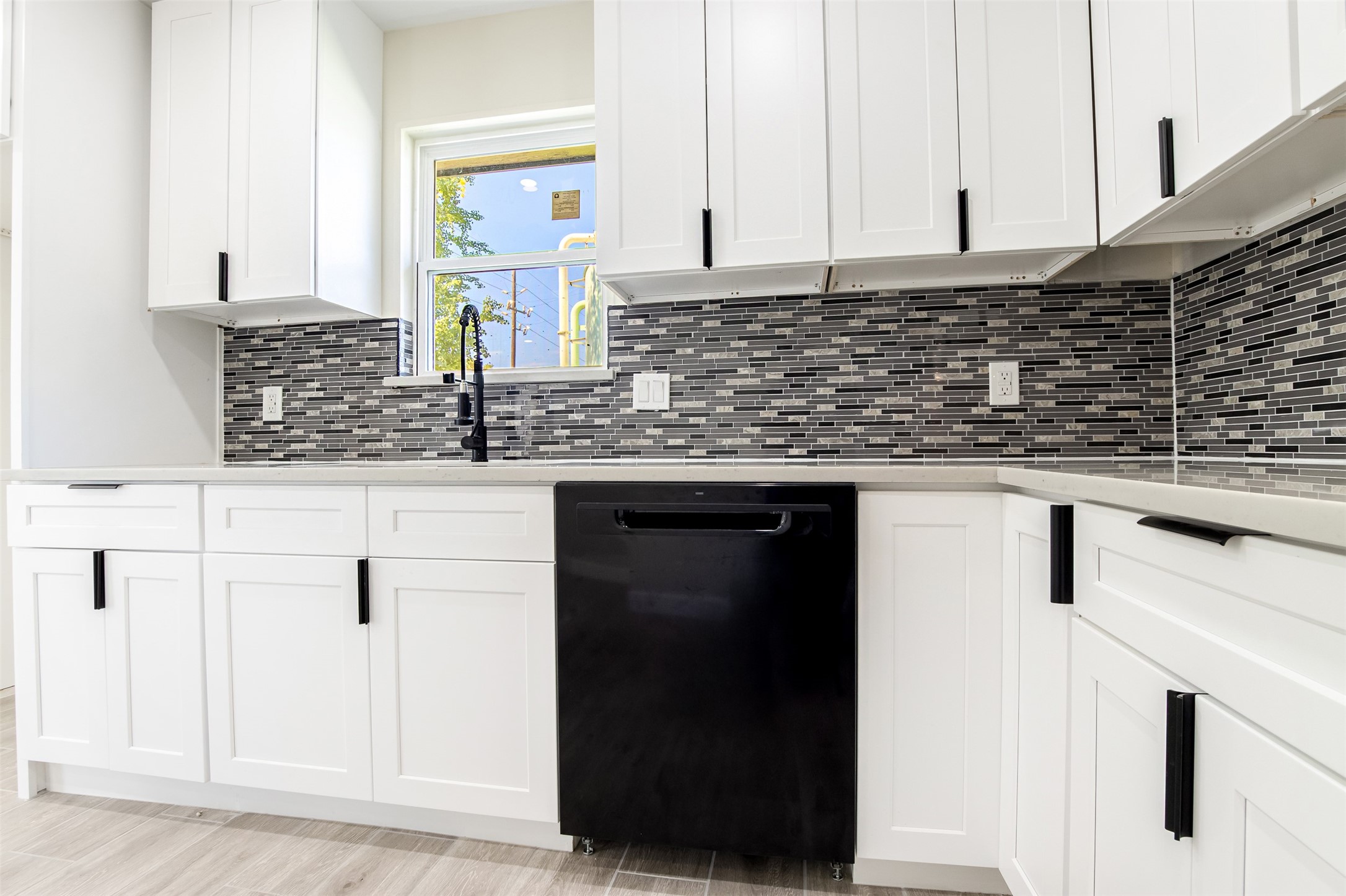 11203 Rousseau Drive Houston, TX 77065 - Photo 12 of 50 a kitchen with granite countertop a sink and cabinets