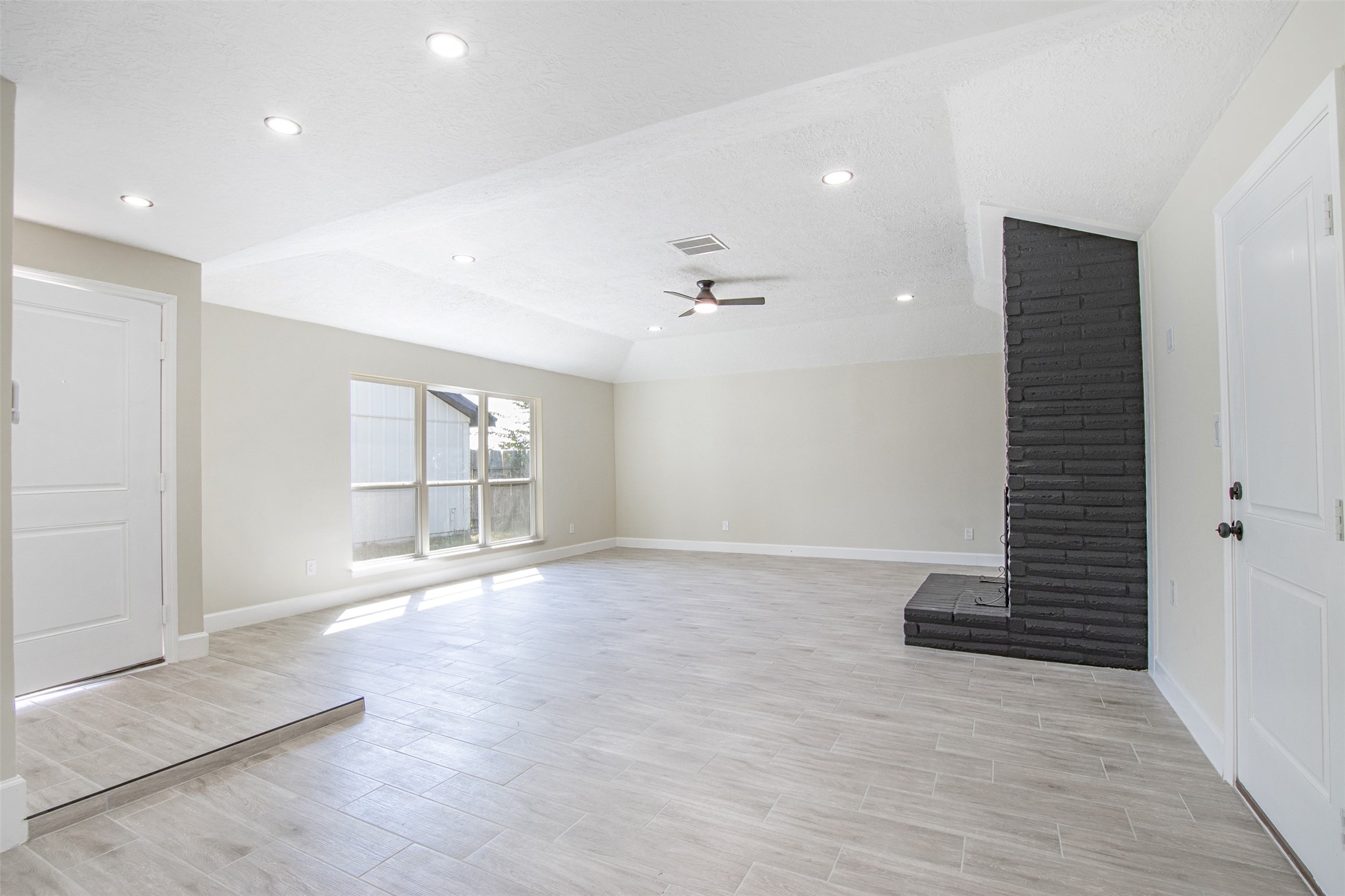 11203 Rousseau Drive Houston, TX 77065 - Photo 14 of 50 wooden floor in an empty room with a window