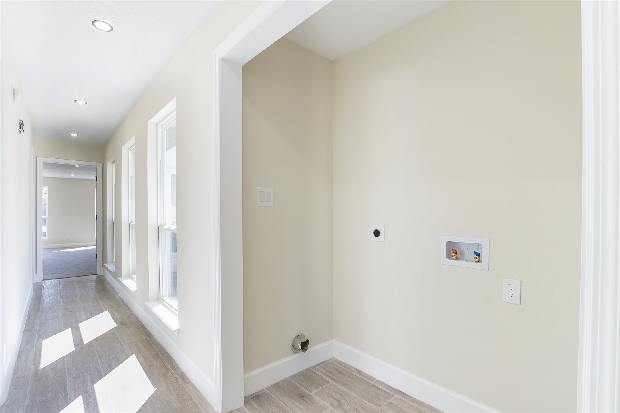 11203 Rousseau Drive Houston, TX 77065 - Photo 18 of 50 a view of a hallway with wooden floor