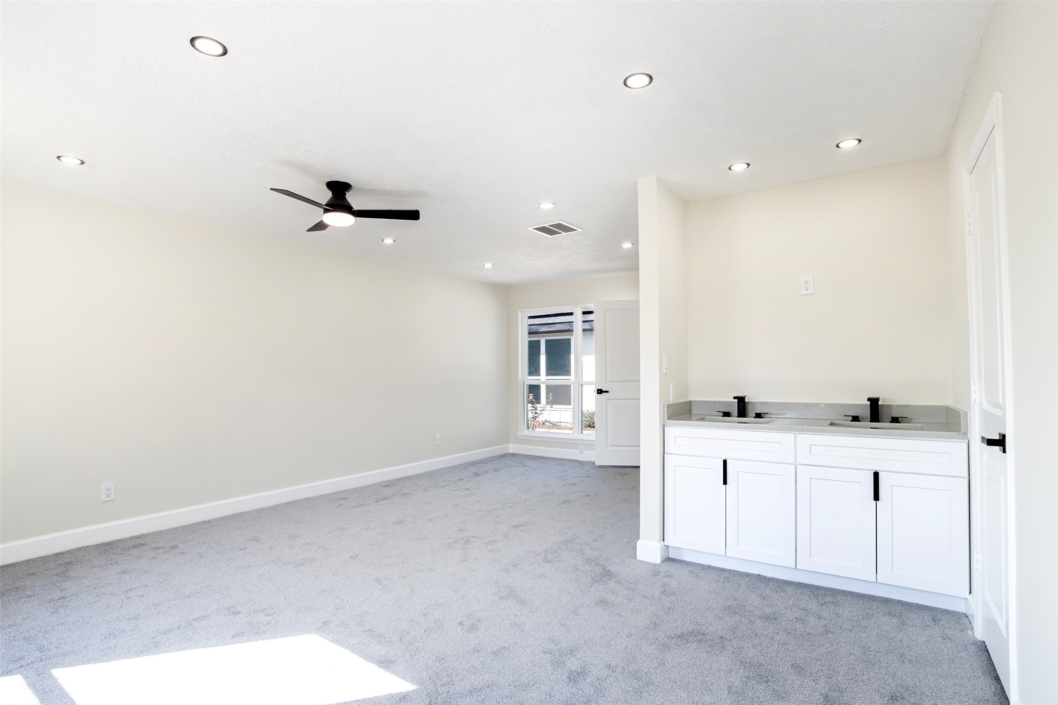 11203 Rousseau Drive Houston, TX 77065 - Photo 22 of 50 a view of cabinets and bathroom with a sink