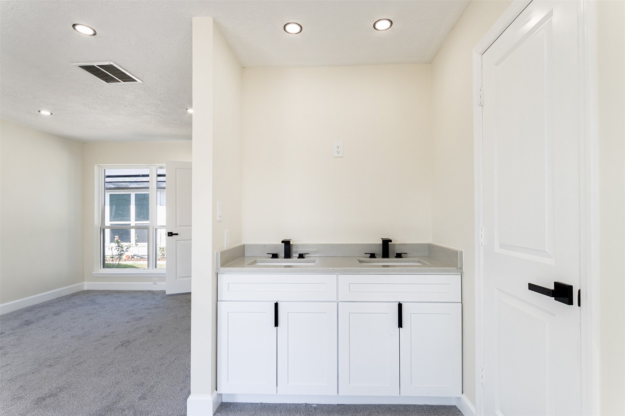 11203 Rousseau Drive Houston, TX 77065 - Photo 23 of 50 a bathroom with a sink vanity and a mirror